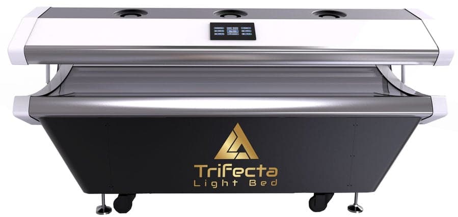 Trifecta full-body red light therapy bed glowing red